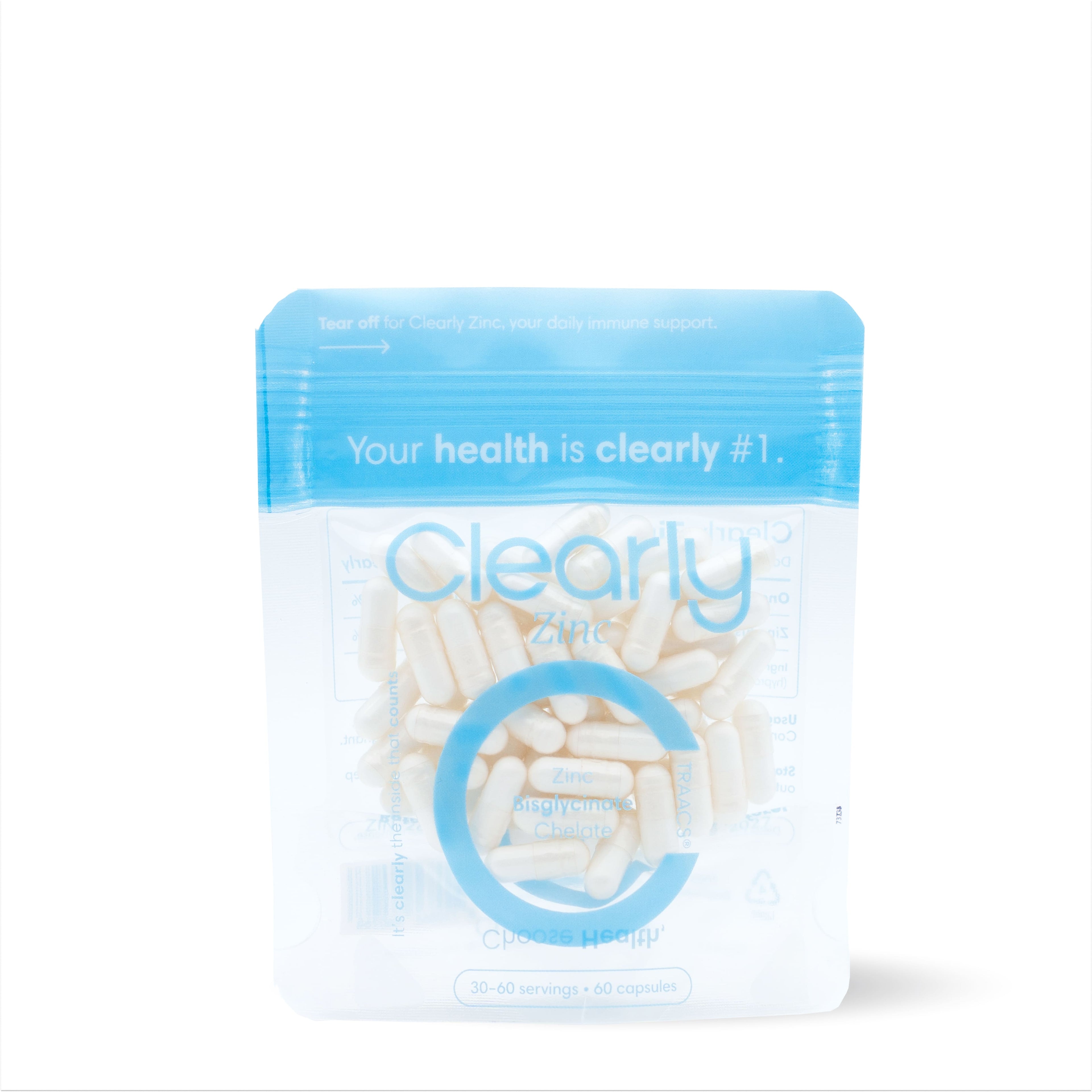 Bottle of Clearly Zinc dietary supplement with capsules on a clean surface, showcasing the supplement's packaging.